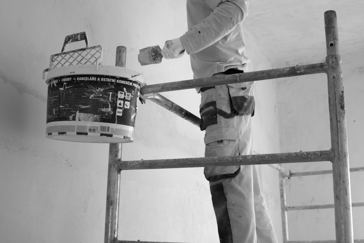 Painter rolling a wall